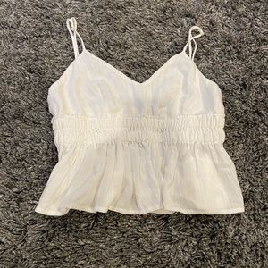 White ruffle bottom tank top